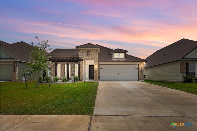 7005 Mcgregor Loop, Killeen, TX 76549 - view of front facade featuring concrete driveway, a front yard, a garage, and brick siding