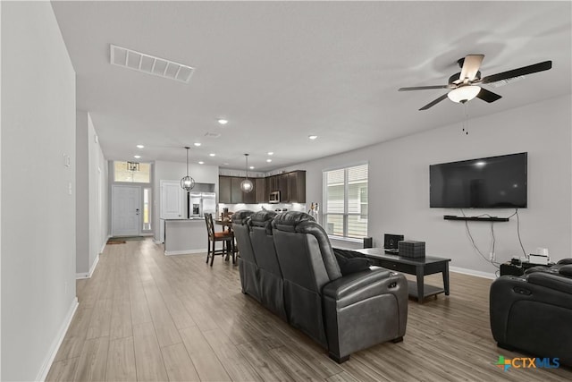 7005 Mcgregor Loop, Killeen, TX 76549 - living room featuring light wood-type flooring, ceiling fan, and recessed lighting