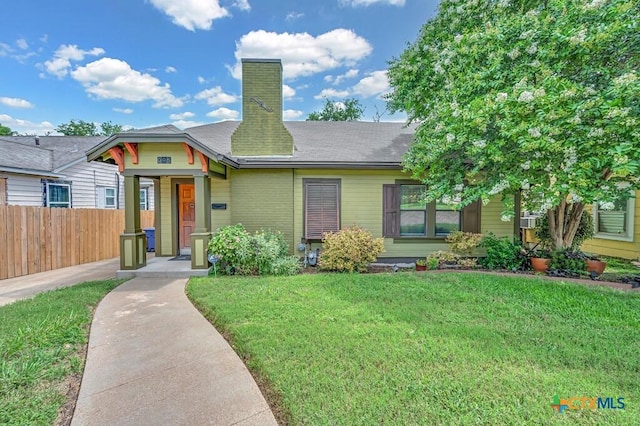 905 N 33rd St, Waco, TX 76707 - view of front of home with a chimney and brick siding