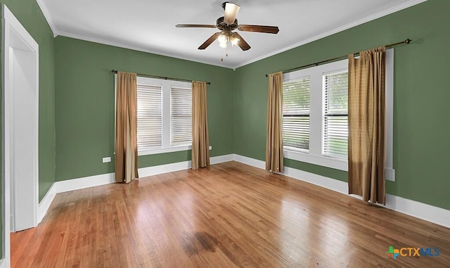 905 N 33rd St, Waco, TX 76707 - spare room featuring wood finished floors, a ceiling fan, and ornamental molding