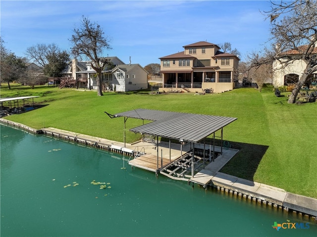 view of dock featuring a water view and a yard