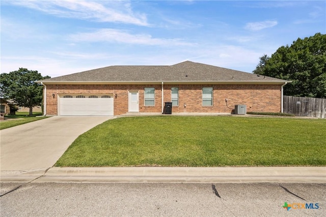 2206 Pheasant Run Ln, Temple, TX 76502 - view of front of house featuring an attached garage, concrete driveway, brick siding, and a shingled roof