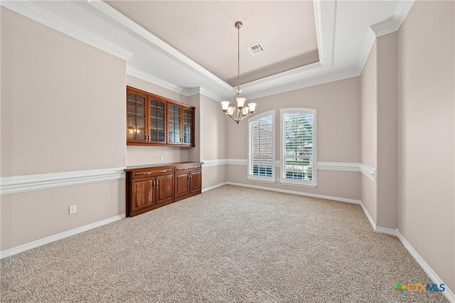 2206 Pheasant Run Ln, Temple, TX 76502 - unfurnished dining area featuring a raised ceiling, a chandelier, light carpet, and ornamental molding