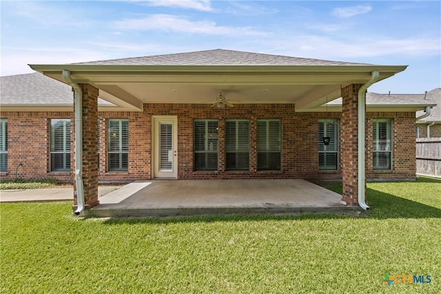 2206 Pheasant Run Ln, Temple, TX 76502 - rear view of property featuring brick siding, a lawn, a ceiling fan, a patio, and a shingled roof