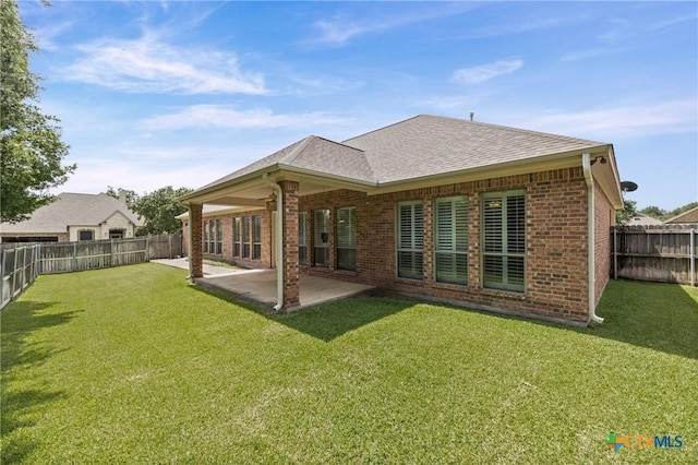 2206 Pheasant Run Ln, Temple, TX 76502 - rear view of house with brick siding, a fenced backyard, a patio, and roof with shingles