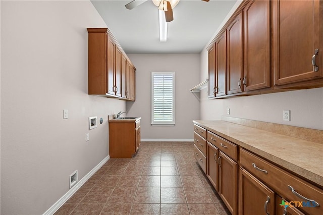 2206 Pheasant Run Ln, Temple, TX 76502 - laundry area with cabinet space, a ceiling fan, washer hookup, and dark tile patterned floors
