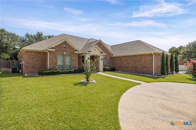 2206 Pheasant Run Ln, Temple, TX 76502 - view of front facade with brick siding, a garage, roof with shingles, and driveway