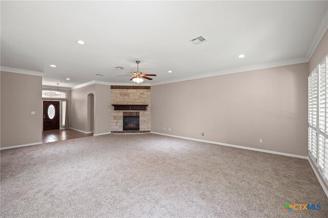 2206 Pheasant Run Ln, Temple, TX 76502 - unfurnished living room featuring carpet, a ceiling fan, ornamental molding, recessed lighting, and a fireplace