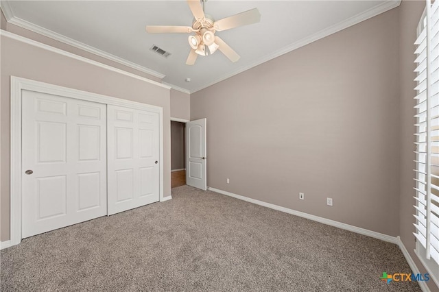 2206 Pheasant Run Ln, Temple, TX 76502 - unfurnished bedroom featuring carpet flooring, crown molding, multiple windows, and a closet