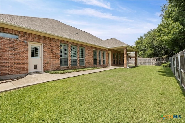 2206 Pheasant Run Ln, Temple, TX 76502 - rear view of property with brick siding, a fenced backyard, and roof with shingles