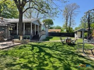 304 Oak Plz, Austin, TX 78753 - view of yard featuring a sunroom