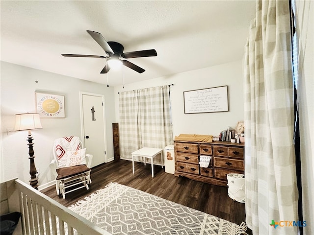 bedroom with ceiling fan and dark hardwood / wood-style flooring