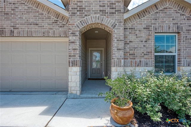 property entrance with a garage