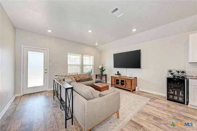 living room featuring light wood-type flooring and wine cooler