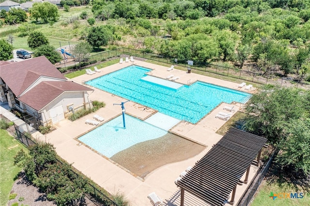 view of swimming pool with a patio area