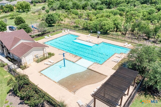 view of swimming pool with a patio area