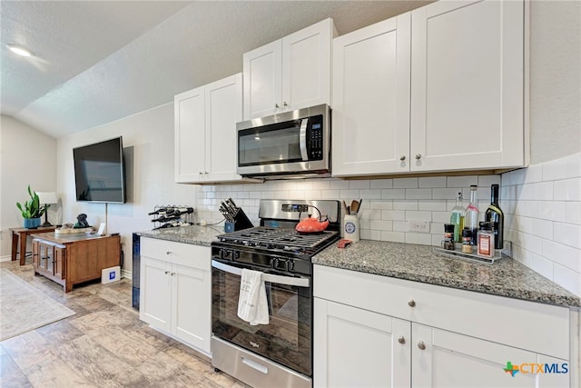 kitchen with white cabinets and appliances with stainless steel finishes