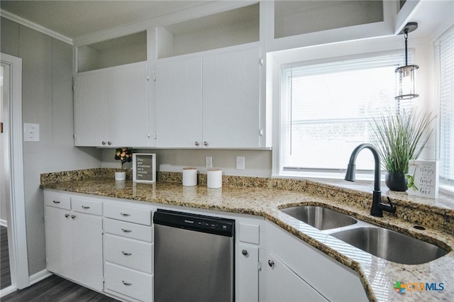 kitchen with stone countertops, a sink, white cabinets, hanging light fixtures, and stainless steel dishwasher