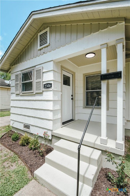 entrance to property featuring board and batten siding