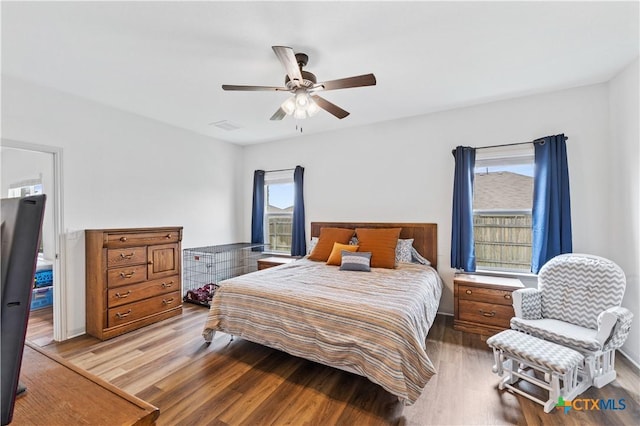 bedroom with wood finished floors and ceiling fan