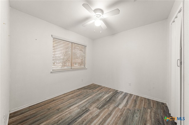 unfurnished bedroom with ceiling fan, dark hardwood / wood-style flooring, and a closet