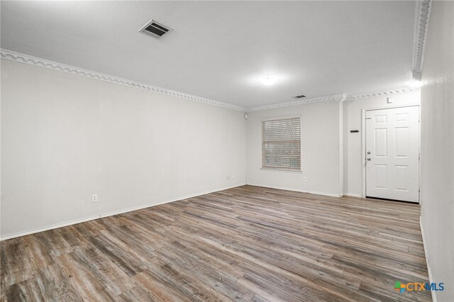 spare room with hardwood / wood-style flooring