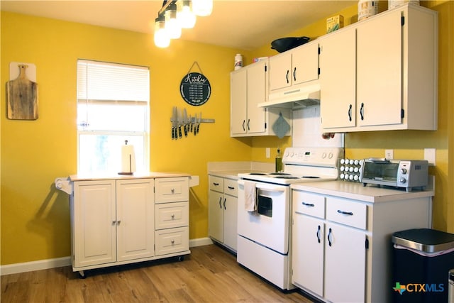 kitchen with light hardwood / wood-style flooring, white cabinets, and electric range