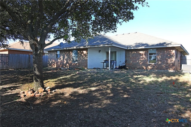 rear view of property with cooling unit