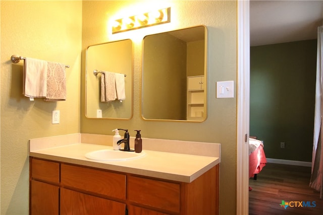 bathroom with wood-type flooring and vanity