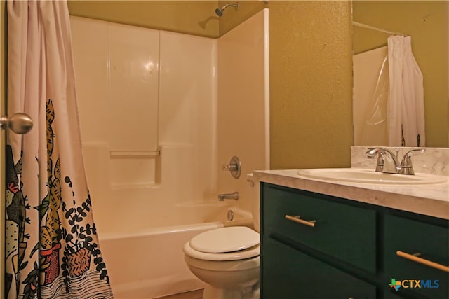 full bathroom featuring vanity, toilet, and shower / tub combo