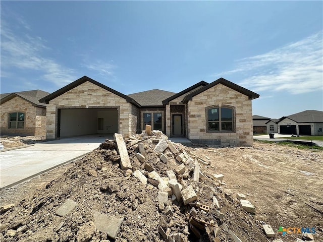 2003 Yarrow Rd, Temple, TX 76502 - french provincial home with an attached garage, driveway, and stone siding