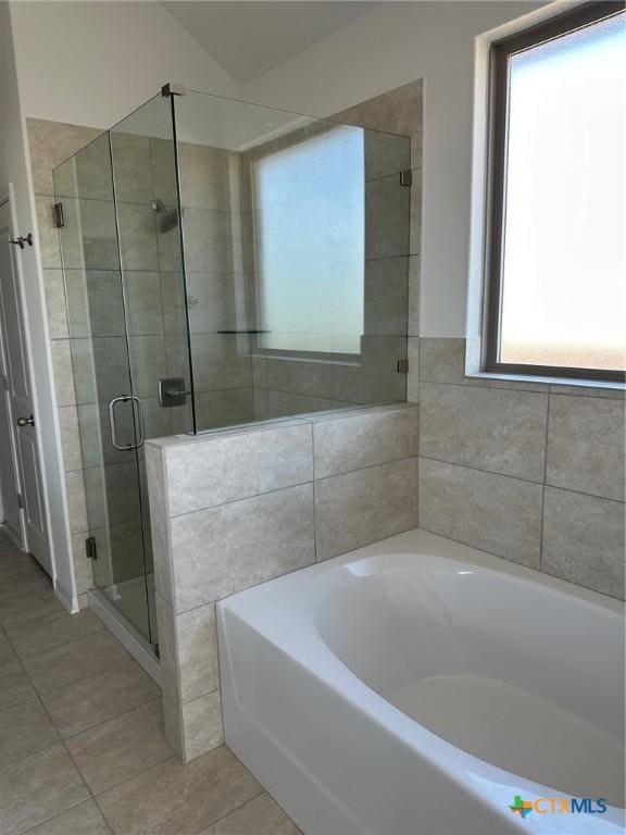 7213 Touchstone Dr, Temple, TX 76502 - bathroom with tile patterned floors, a garden tub, and a stall shower
