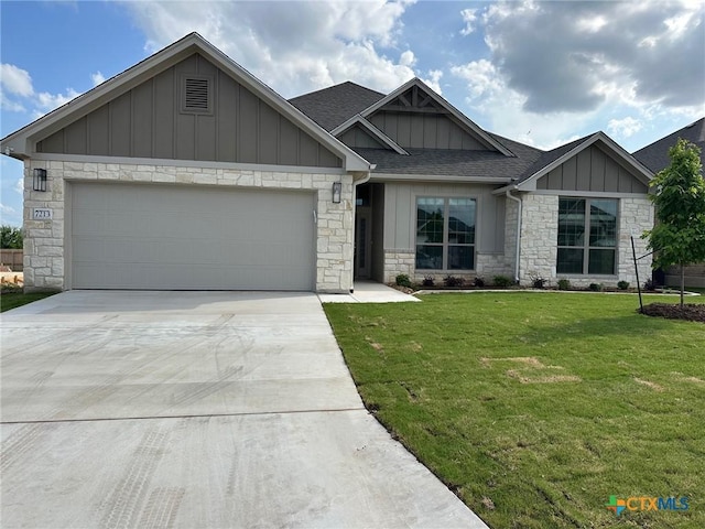 7213 Touchstone Dr, Temple, TX 76502 - craftsman inspired home with board and batten siding, stone siding, roof with shingles, a garage, and a front yard
