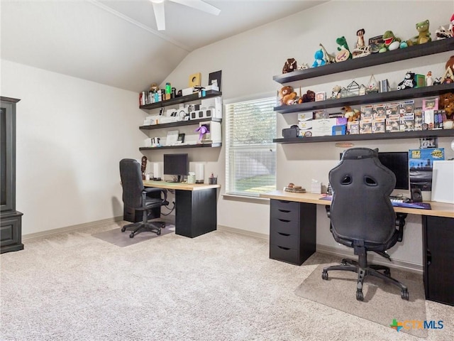 office space featuring vaulted ceiling, ceiling fan, and light colored carpet