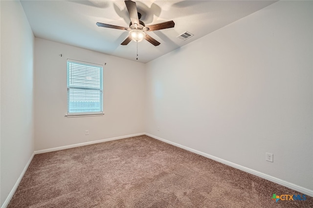 unfurnished room featuring ceiling fan and carpet