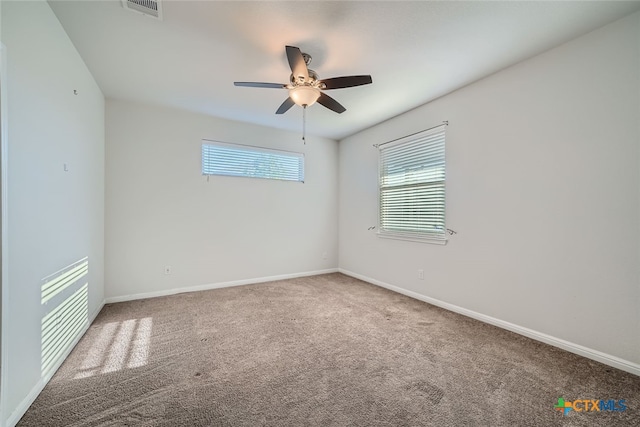 spare room with carpet flooring and ceiling fan