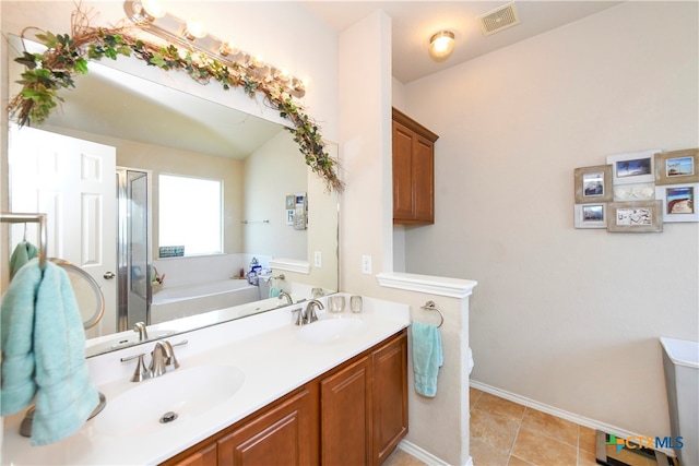 bathroom with vanity, tile patterned flooring, and separate shower and tub