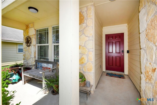 doorway to property featuring a porch