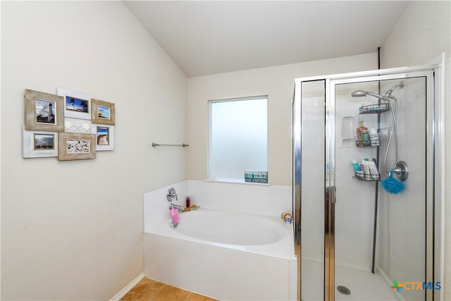 bathroom with tile patterned floors and separate shower and tub