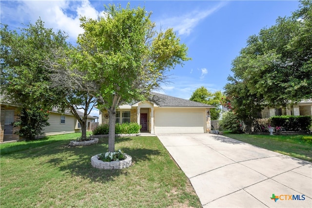 view of front of property featuring a garage and a front yard