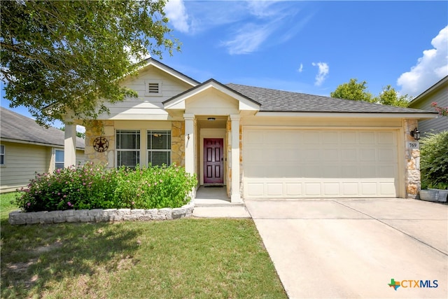 view of front of home featuring a garage and a front yard