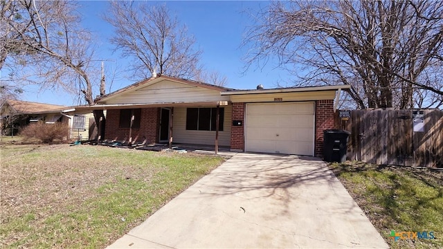 ranch-style house featuring an attached garage, brick siding, fence, concrete driveway, and a front lawn