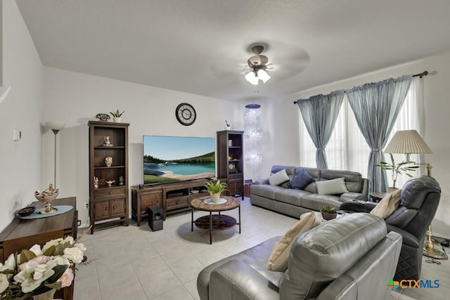 living room featuring ceiling fan and light tile patterned floors