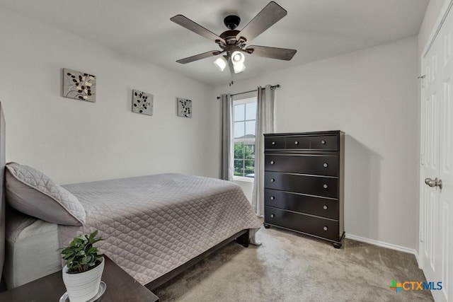 bedroom featuring carpet flooring, baseboards, and ceiling fan