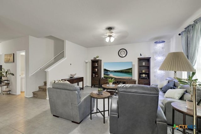 living room featuring stairs, ceiling fan, and light tile patterned flooring