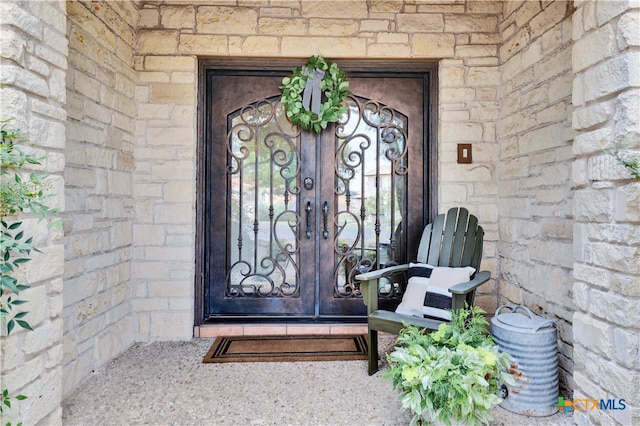 entrance to property featuring french doors