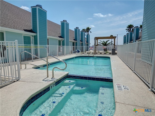 view of swimming pool with a patio area