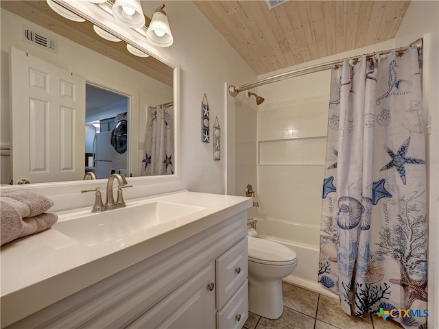 full bathroom with stacked washer and clothes dryer, tile patterned floors, vanity, toilet, and shower / bath combo with shower curtain