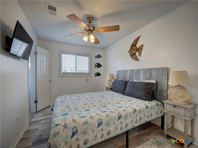 bedroom featuring wood-type flooring and ceiling fan