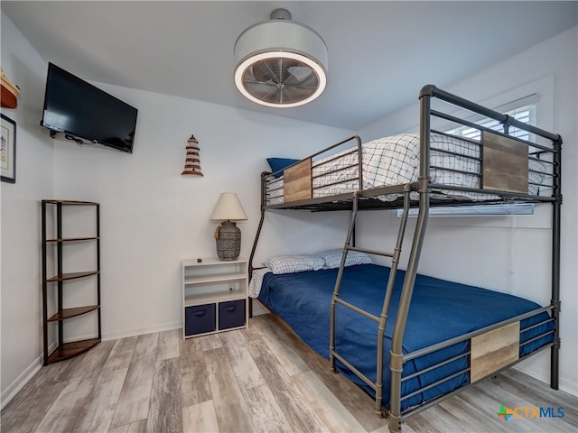 bedroom with wood-type flooring